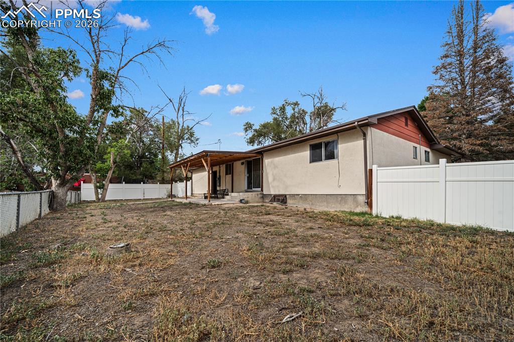 11 Mac Naughton Road Pueblo, CO 81001 - Photo 24 of 29 a view of a house with a backyard