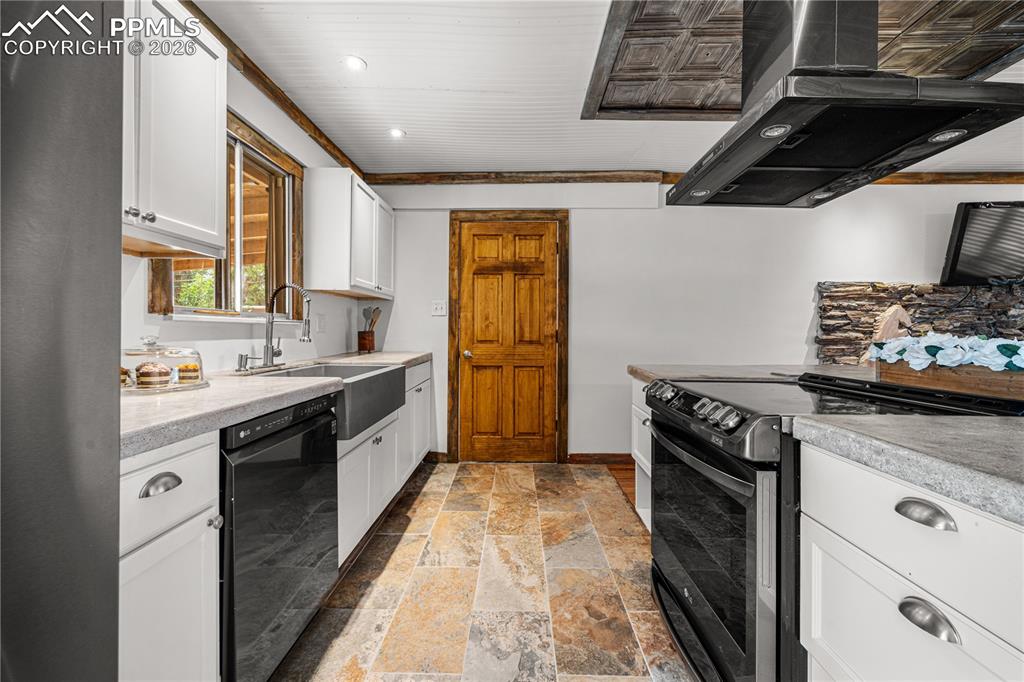 11 Mac Naughton Road Pueblo, CO 81001 - Photo 5 of 29 a large kitchen with stainless steel appliances granite countertop a stove and a sink