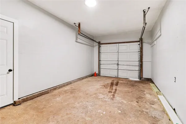 a view of room that has a white bed