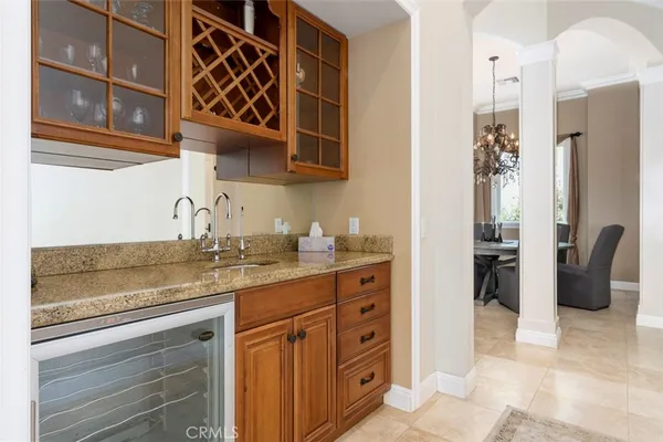 a bathroom with a double vanity sink a mirror and a bathtub