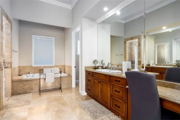a kitchen with stainless steel appliances granite countertop a sink a stove and a wooden floors