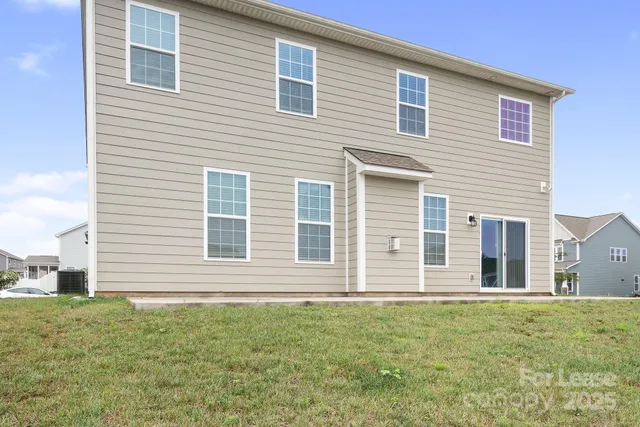 a view of swimming pool with outdoor seating and yard