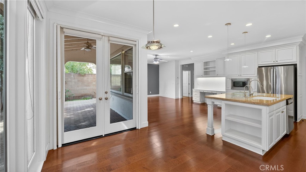 30 Maple Leaf Irvine, CA 92618 - Photo 11 of 19 a kitchen with kitchen island granite countertop a refrigerator and a stove top oven