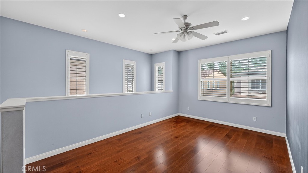 30 Maple Leaf Irvine, CA 92618 - Photo 14 of 19 a view of a livingroom with a ceiling fan and wooden floor