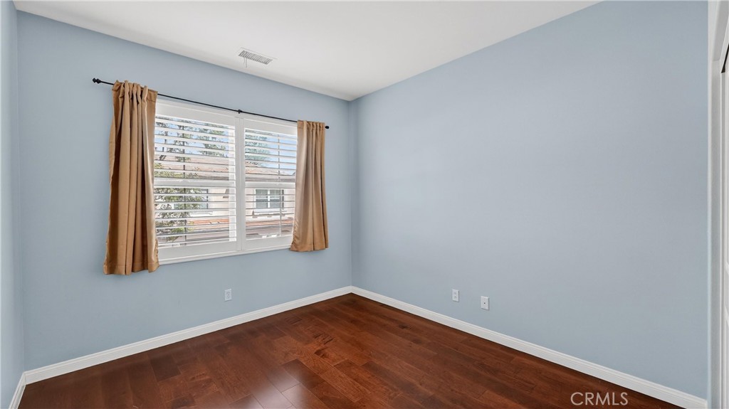 30 Maple Leaf Irvine, CA 92618 - Photo 16 of 19 a view of an empty room with wooden floor and a window