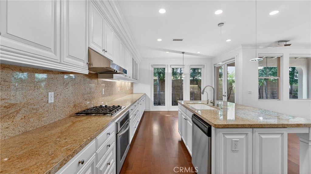 30 Maple Leaf Irvine, CA 92618 - Photo 8 of 19 a kitchen with granite countertop a sink stove and cabinets