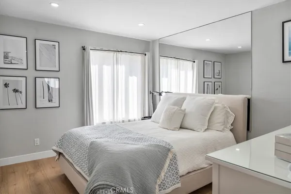 a bedroom with a large bed and a television