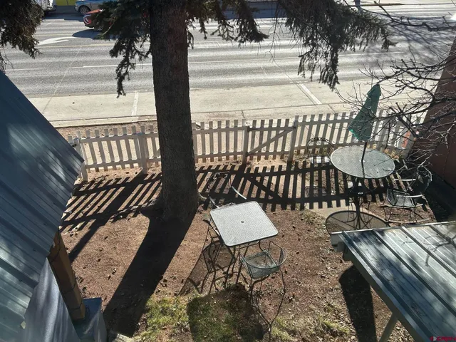 swimming pool view with a seating space
