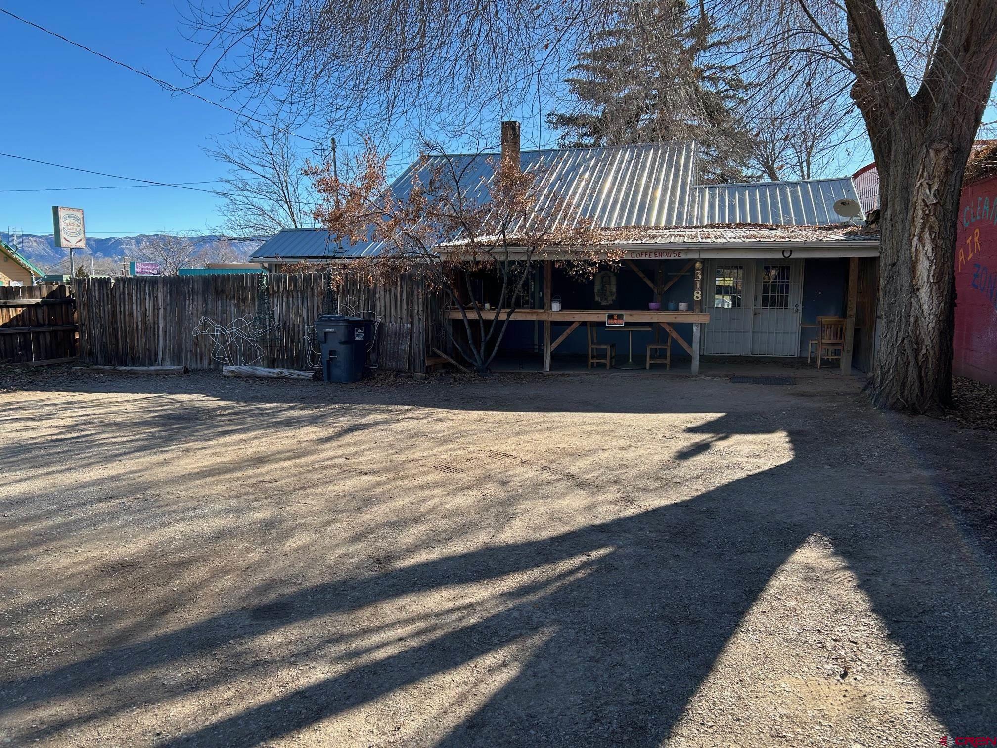 318 East Main Street Cortez, CO 81321 - Photo 24 of 27 a view of a patio with a table and chairs