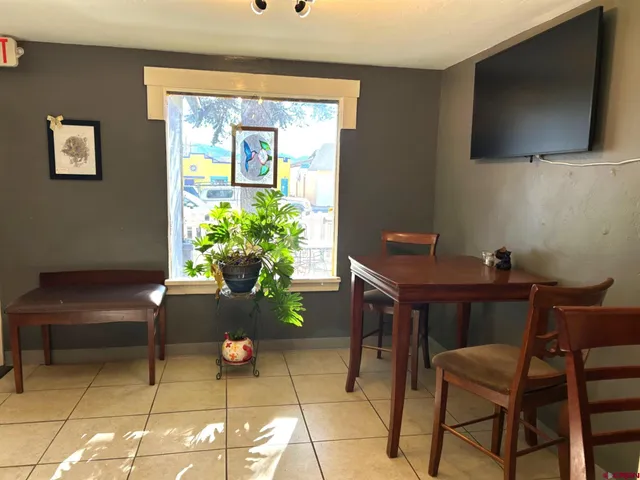 a workspace with furniture and a potted plant