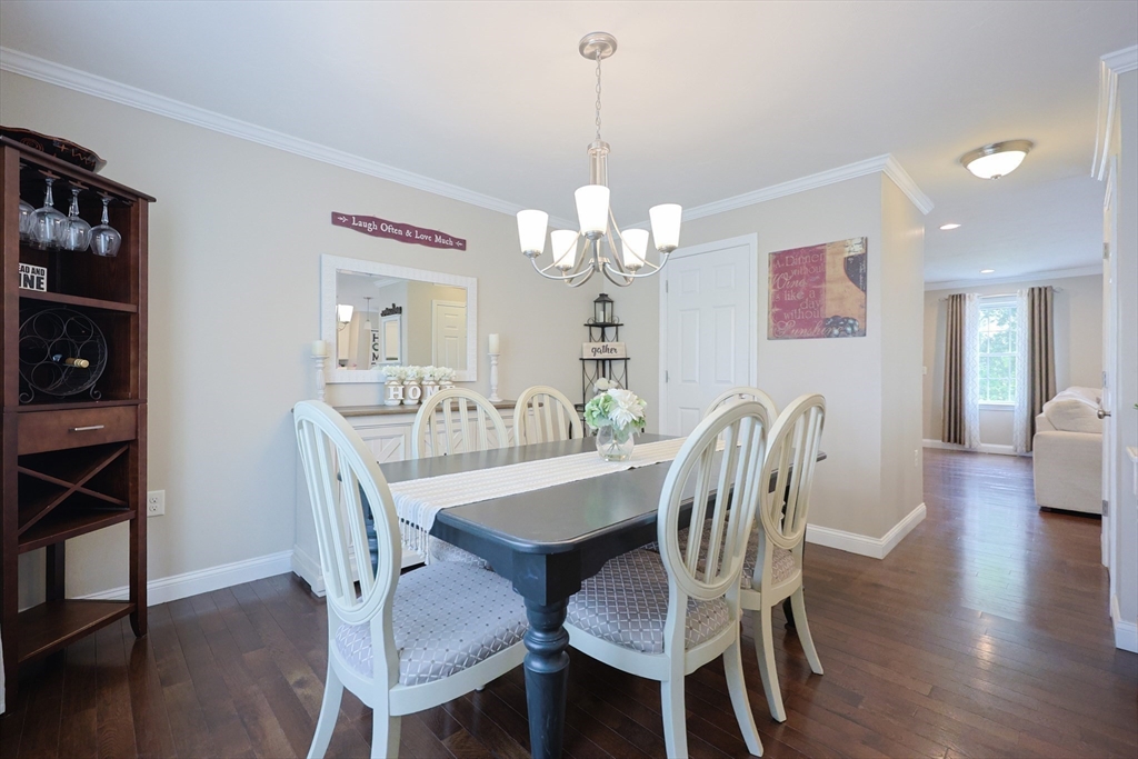 5 Mendon Road, Unit D Attleboro, MA 02703 - Photo 15 of 38 a view of a dining room with furniture and wooden floor