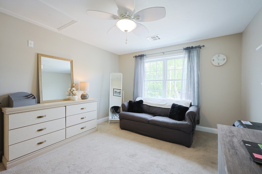 5 Mendon Road, Unit D Attleboro, MA 02703 - Photo 26 of 38 a living room with furniture and a large window