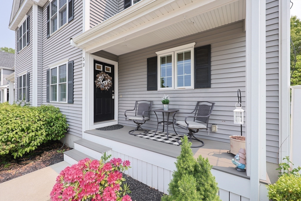 5 Mendon Road, Unit D Attleboro, MA 02703 - Photo 38 of 38 a front view of a house with an outdoor seating