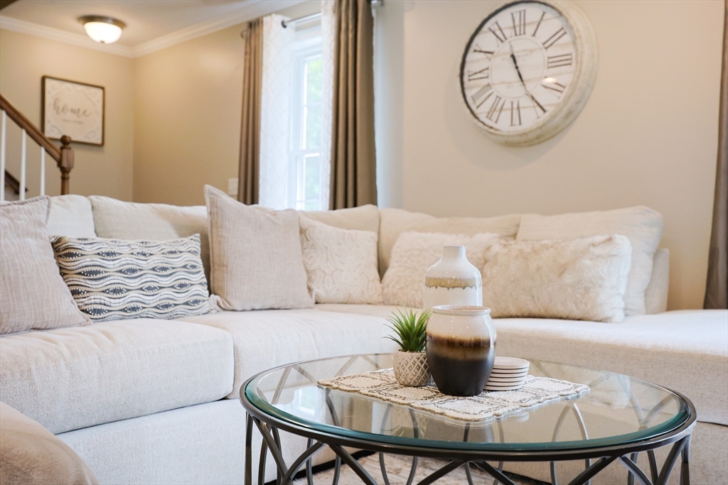 5 Mendon Road, Unit D Attleboro, MA 02703 - Photo 6 of 38 a living room with furniture and a table