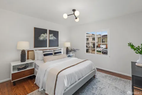 a kitchen with stainless steel appliances granite countertop a stove top oven a sink dishwasher and cabinets with wooden floor