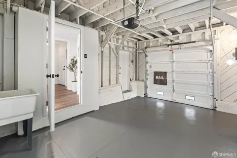 a kitchen with a table and chairs in it