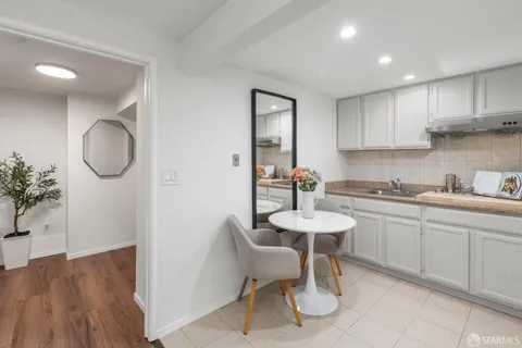 a white toilet sitting next to a bathroom sink