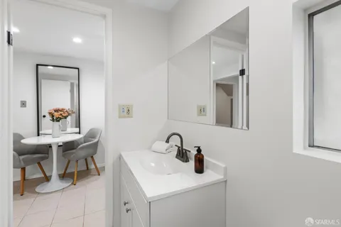 a bed room with a bed and a lamp