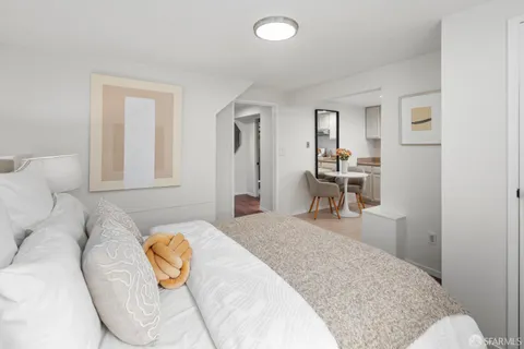 an aerial view of residential houses with city view