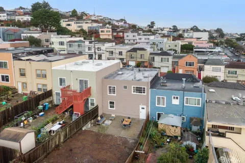 a view of swimming pool of a house with a yard