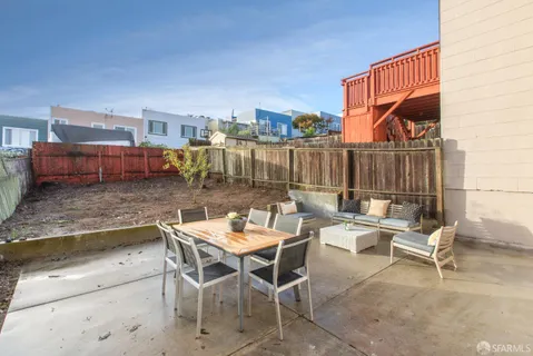 a group of people sitting outside of a building