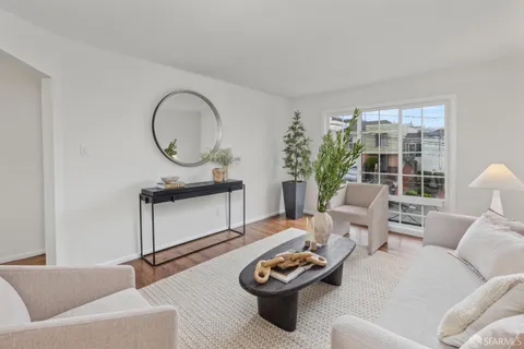 a bedroom with bed and a window