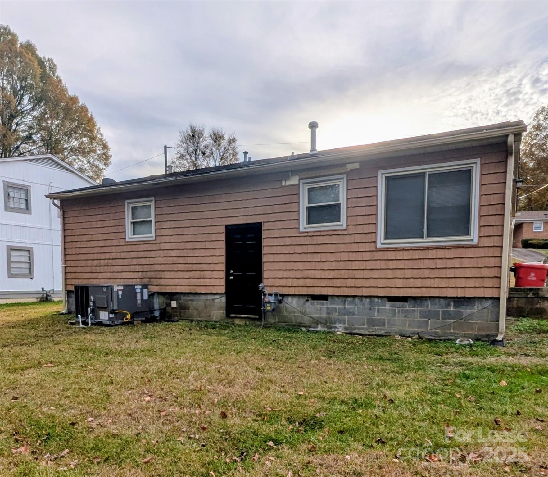 216 Lakeside Avenue Davidson, NC 28036 - Photo 2 of 10 a view of a house with a yard