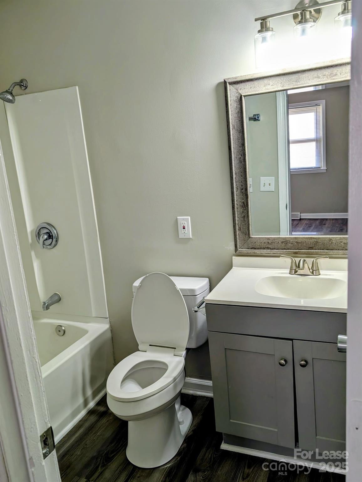 216 Lakeside Avenue Davidson, NC 28036 - Photo 4 of 10 a bathroom with a sink toilet and shower