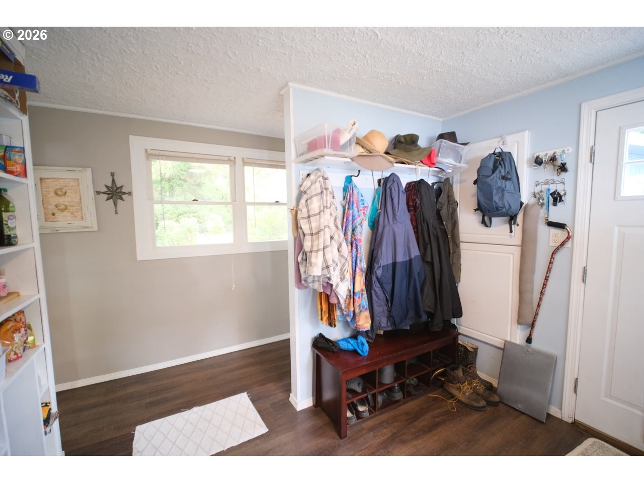 70214 Lakewood Road North Bend, OR 97459 - Photo 16 of 39 a view of walk in closet with clothes and shoes