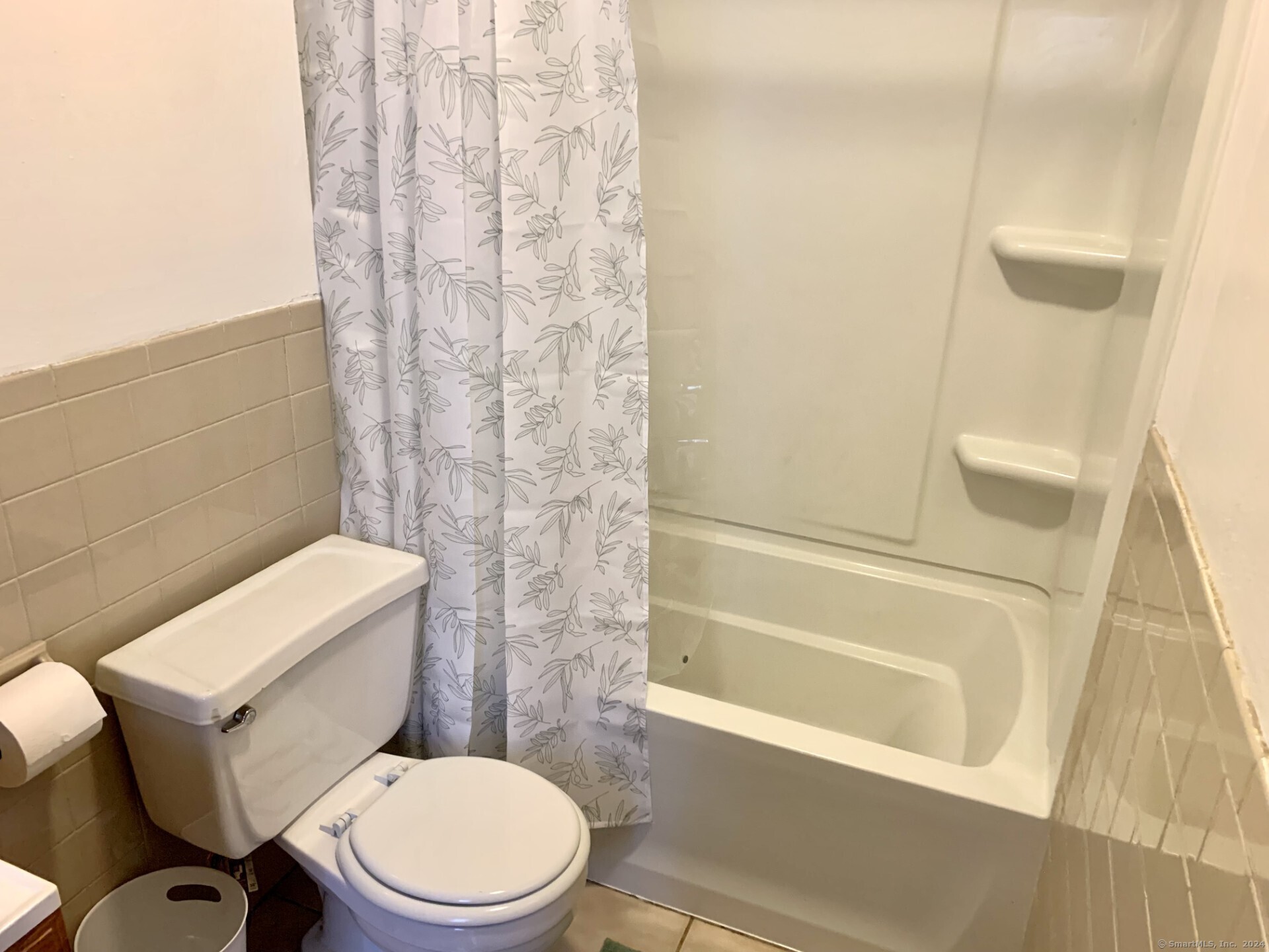 1380 Kossuth Street Bridgeport, CT 06608 - Photo 11 of 22 a white toilet sitting next to a bath tub