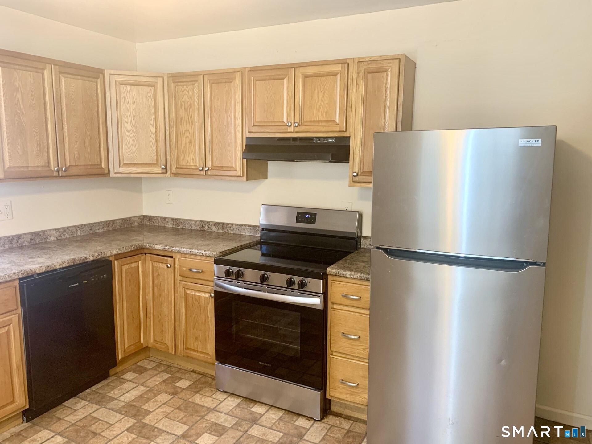 1380 Kossuth Street Bridgeport, CT 06608 - Photo 7 of 22 a kitchen with a stove top oven and refrigerator