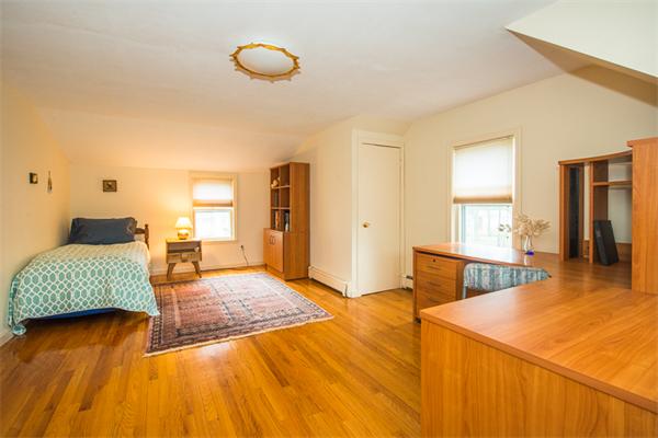 1 4th Street Lexington, MA 02420 - Photo 17 of 22 a bedroom with a bed and a dresser