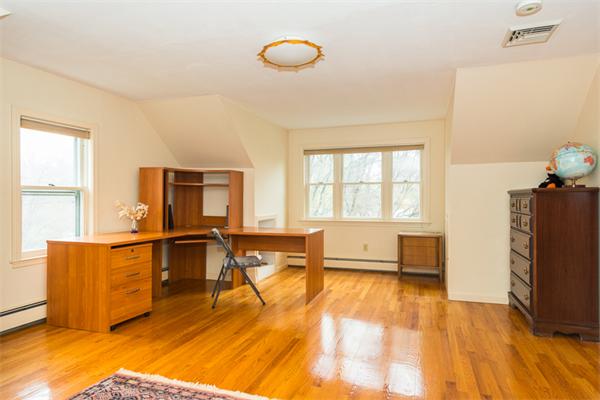 1 4th Street Lexington, MA 02420 - Photo 19 of 22 a living room with furniture and a flat screen tv