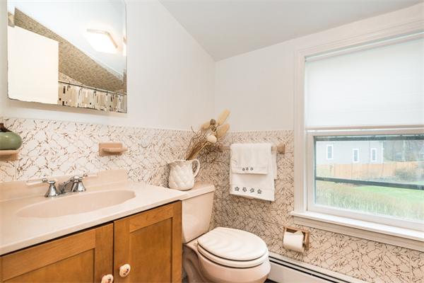 1 4th Street Lexington, MA 02420 - Photo 20 of 22 a bathroom with a sink a toilet and shower