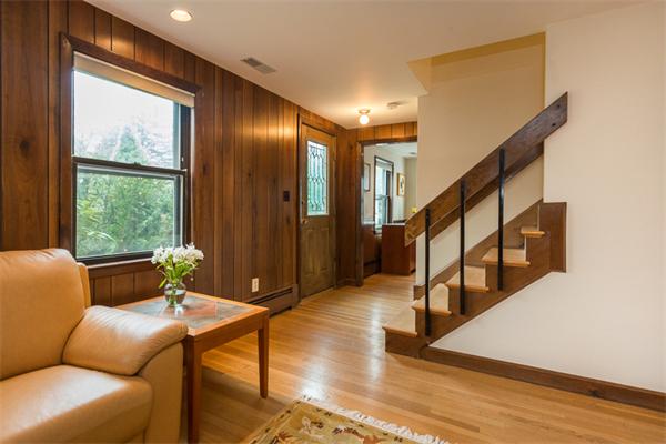 1 4th Street Lexington, MA 02420 - Photo 2 of 22 a living room with furniture and stairs
