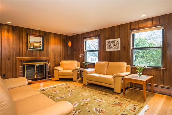 1 4th Street Lexington, MA 02420 - Photo 4 of 22 a living room with furniture and a fireplace