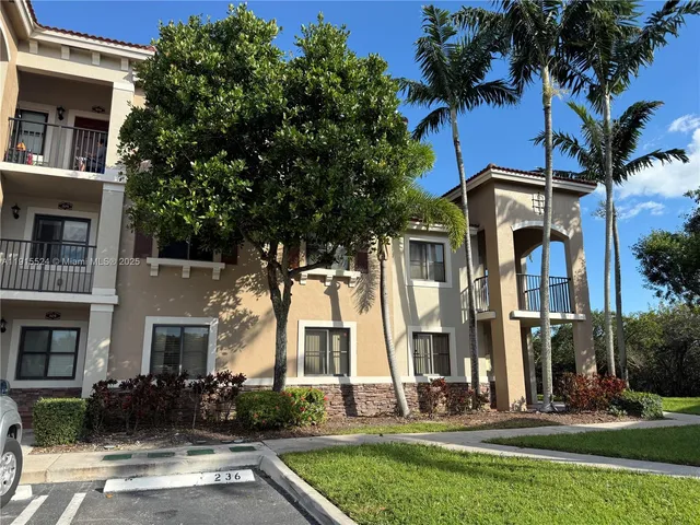 a front view of a building with garden