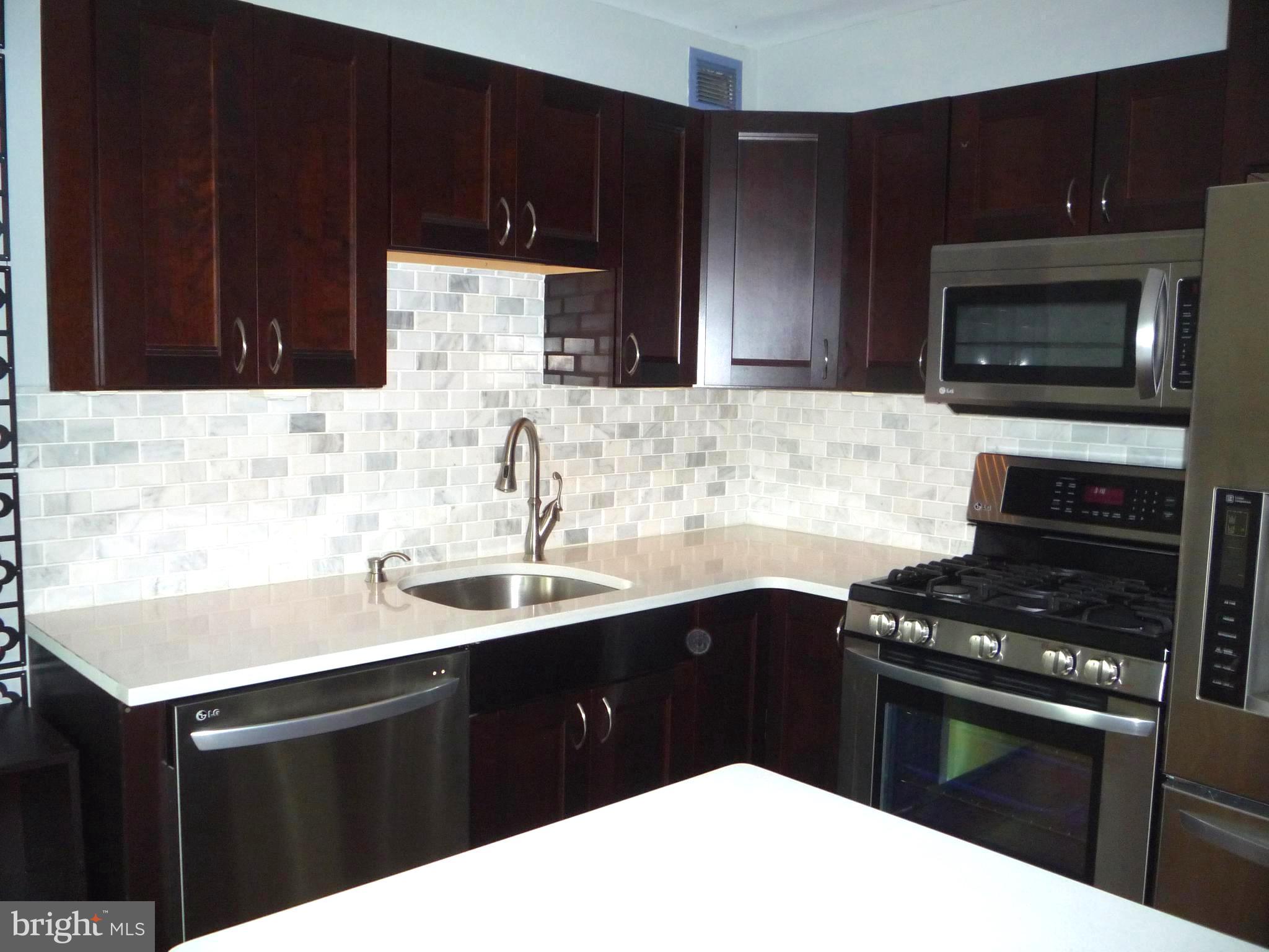 1300 South Arlington Ridge Road, Unit 103 Arlington, VA 22202 - Photo 4 of 30 Silestone Counters, Marble Back splash
