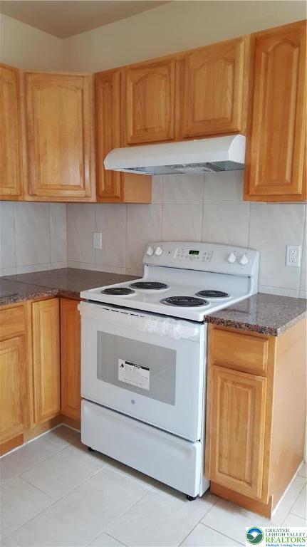 541 Washington Street, Unit 2 Allentown, PA 18102 - Photo 5 of 7 a kitchen with granite countertop cabinets stainless steel appliances and a sink