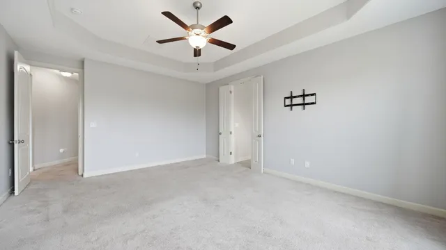 a bathroom with a granite countertop tub sink and mirror
