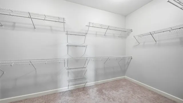 a bathroom with a granite countertop sink a large mirror and a bathtub