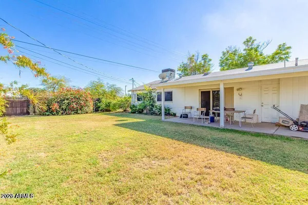 a view of a house with swimming pool yard and patio