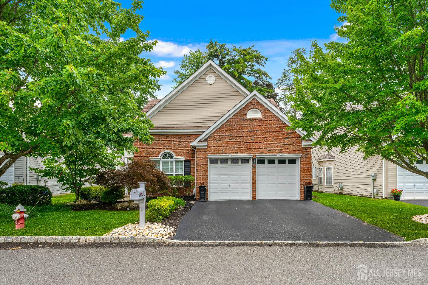 6 George Russell Way Clifton, NJ 07013 - Photo 1 of 45 a view of a house with a yard and large tree