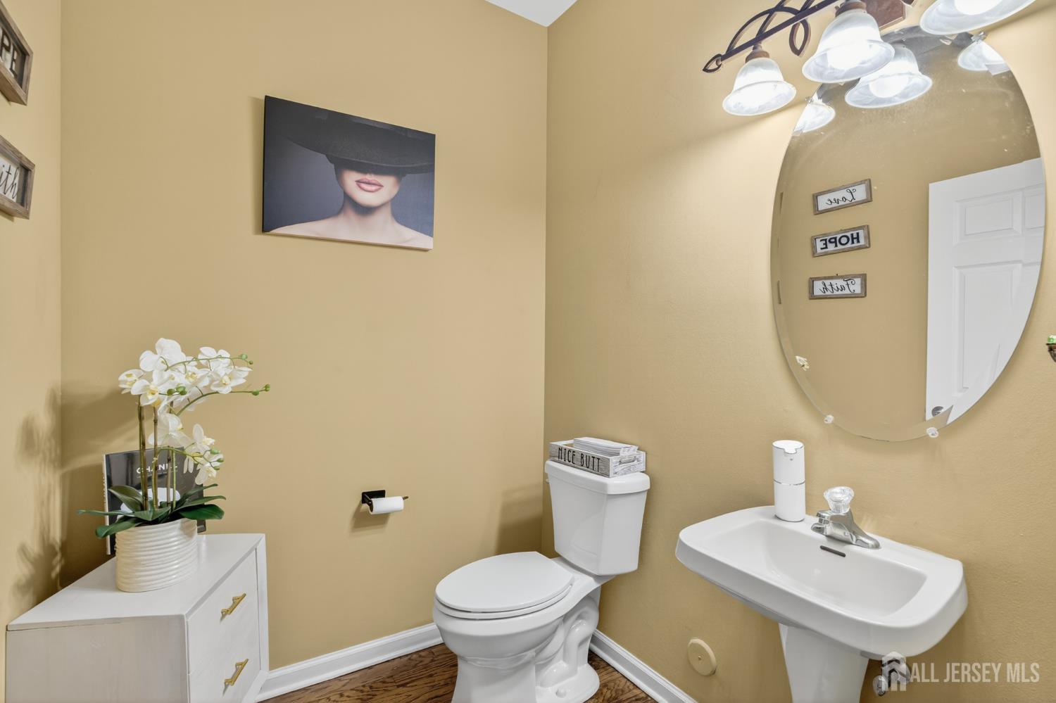 6 George Russell Way Clifton, NJ 07013 - Photo 13 of 45 a bathroom with a toilet sink and mirror