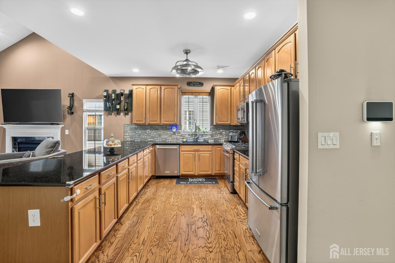 6 George Russell Way Clifton, NJ 07013 - Photo 14 of 45 a kitchen with stainless steel appliances granite countertop a refrigerator a sink and a stove