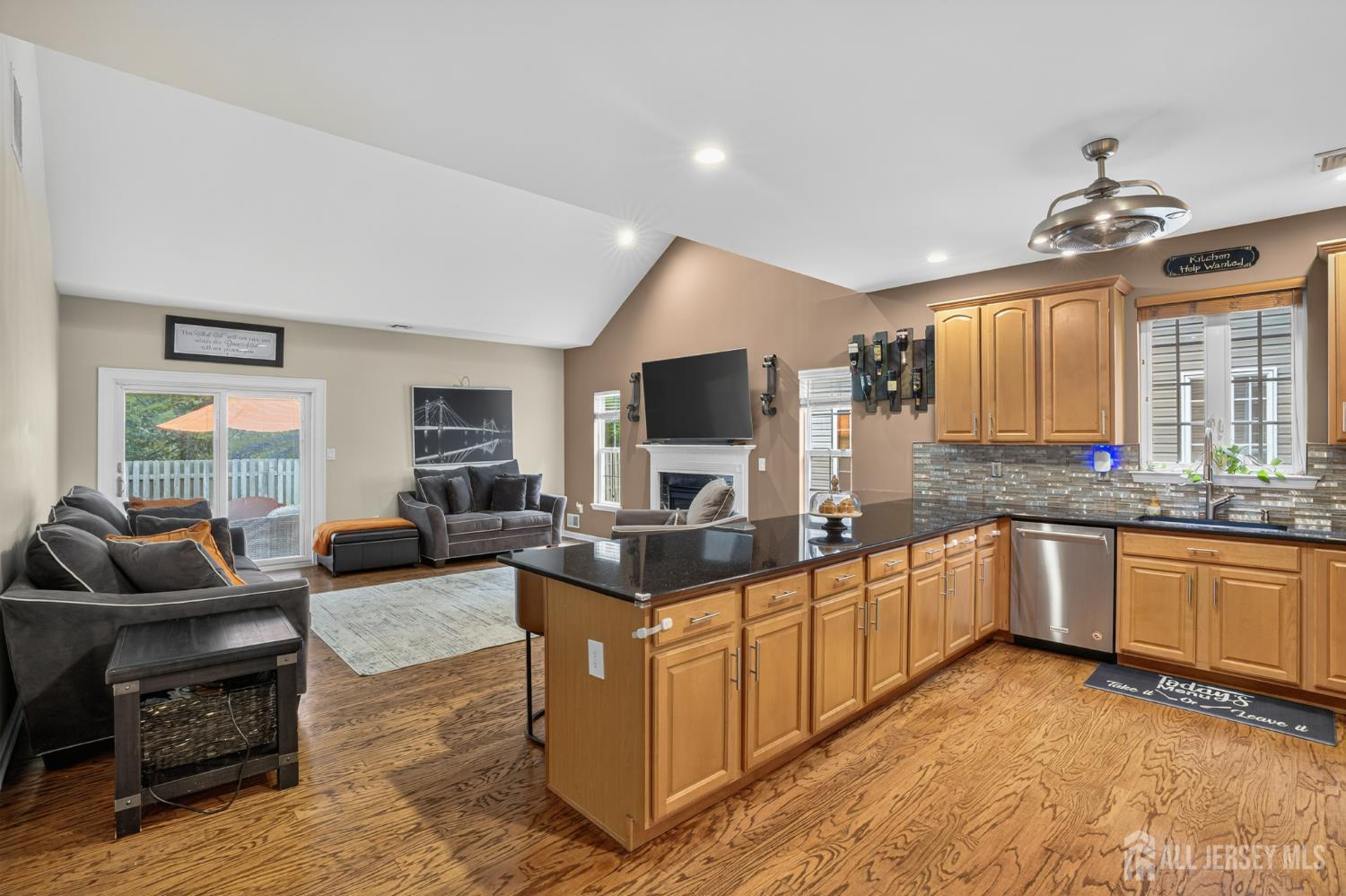 6 George Russell Way Clifton, NJ 07013 - Photo 16 of 45 a living room with granite countertop furniture and fireplace