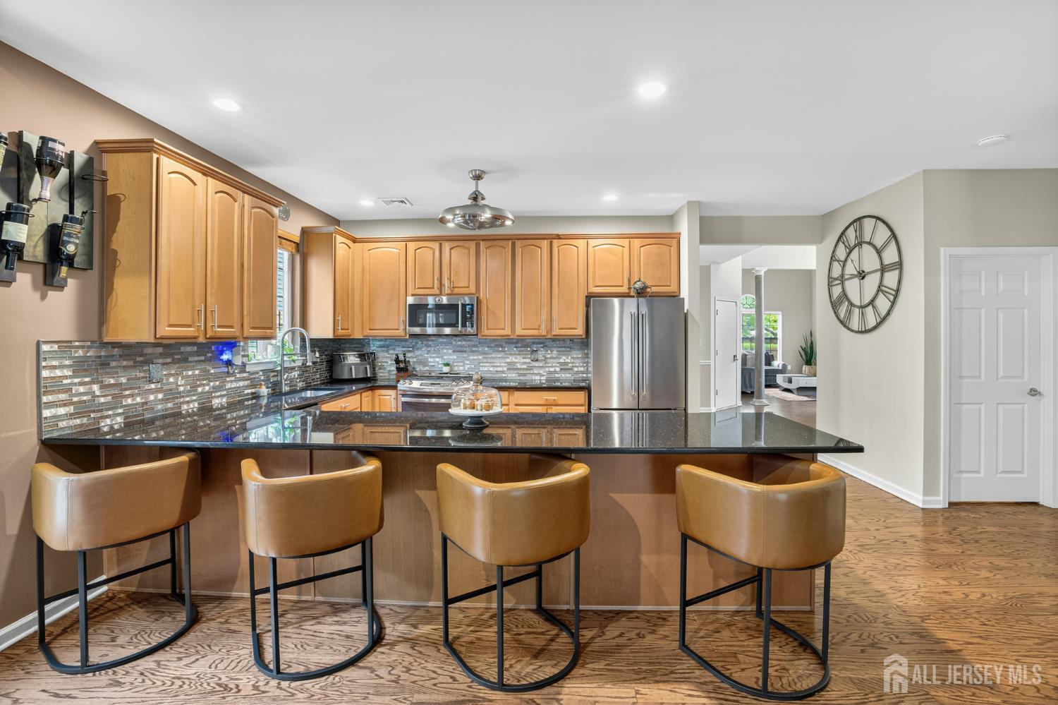 6 George Russell Way Clifton, NJ 07013 - Photo 19 of 45 a kitchen with stainless steel appliances granite countertop a sink and a refrigerator