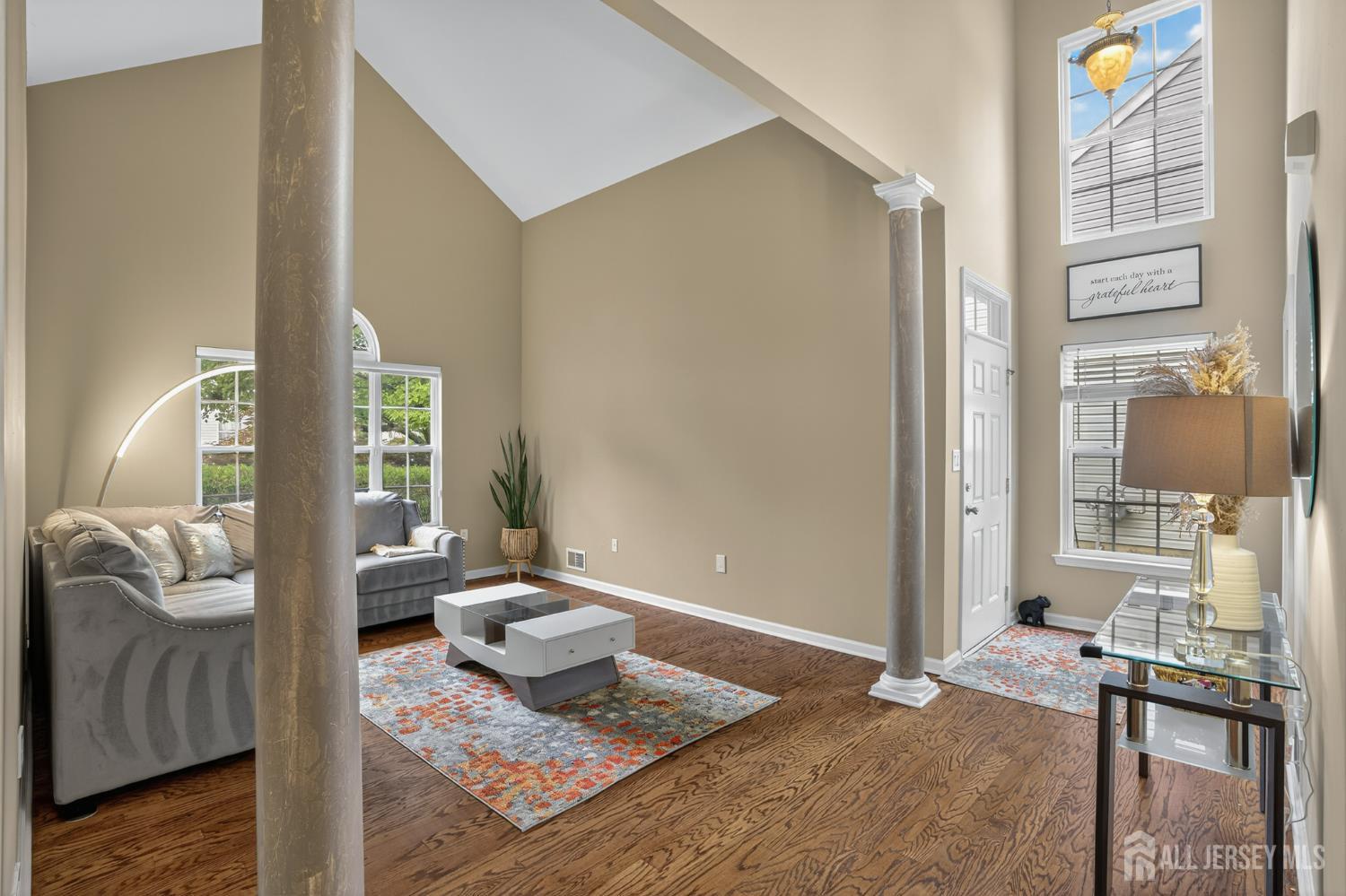 6 George Russell Way Clifton, NJ 07013 - Photo 2 of 45 a living room with furniture and a gate