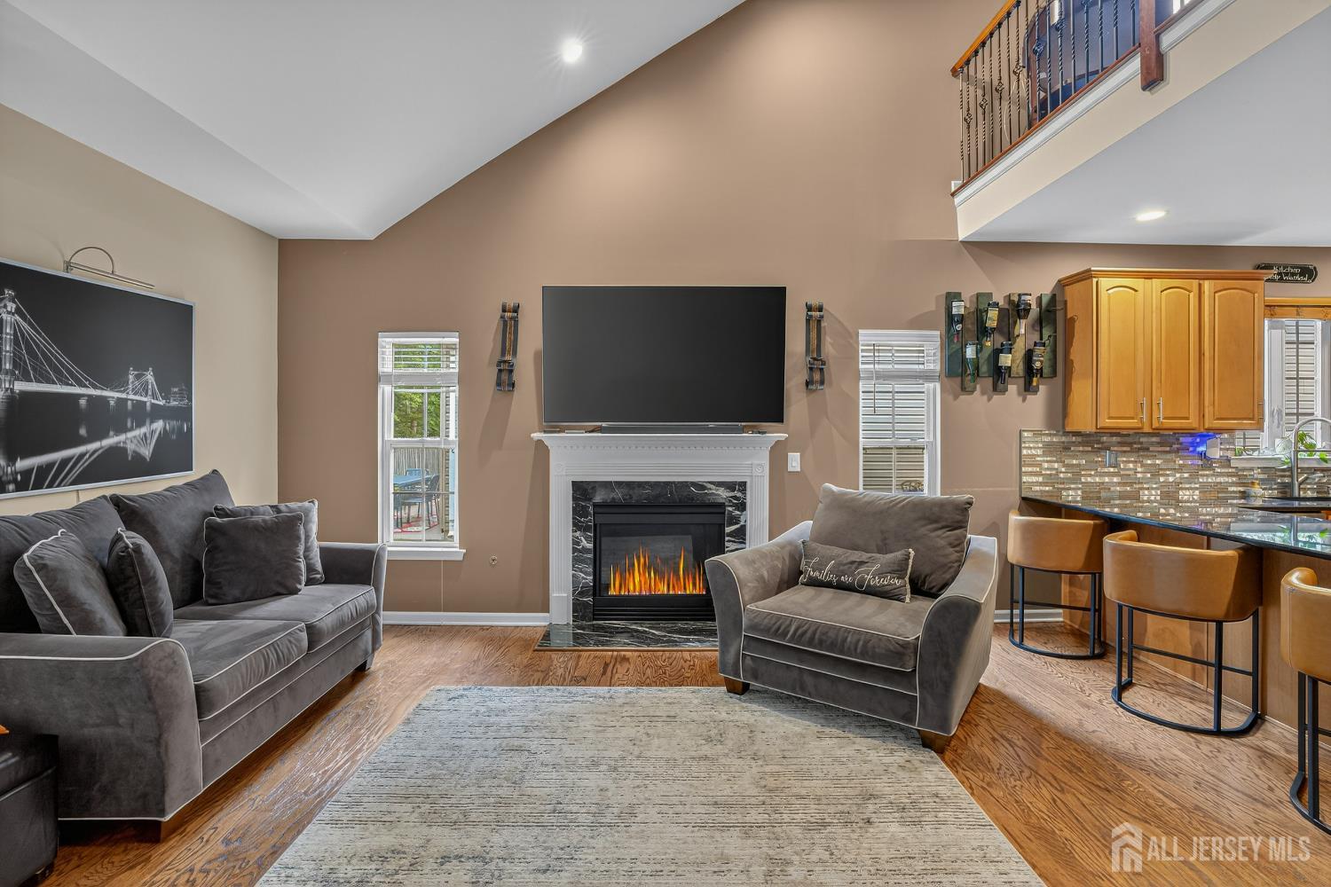 6 George Russell Way Clifton, NJ 07013 - Photo 22 of 45 a living room with furniture and a fireplace