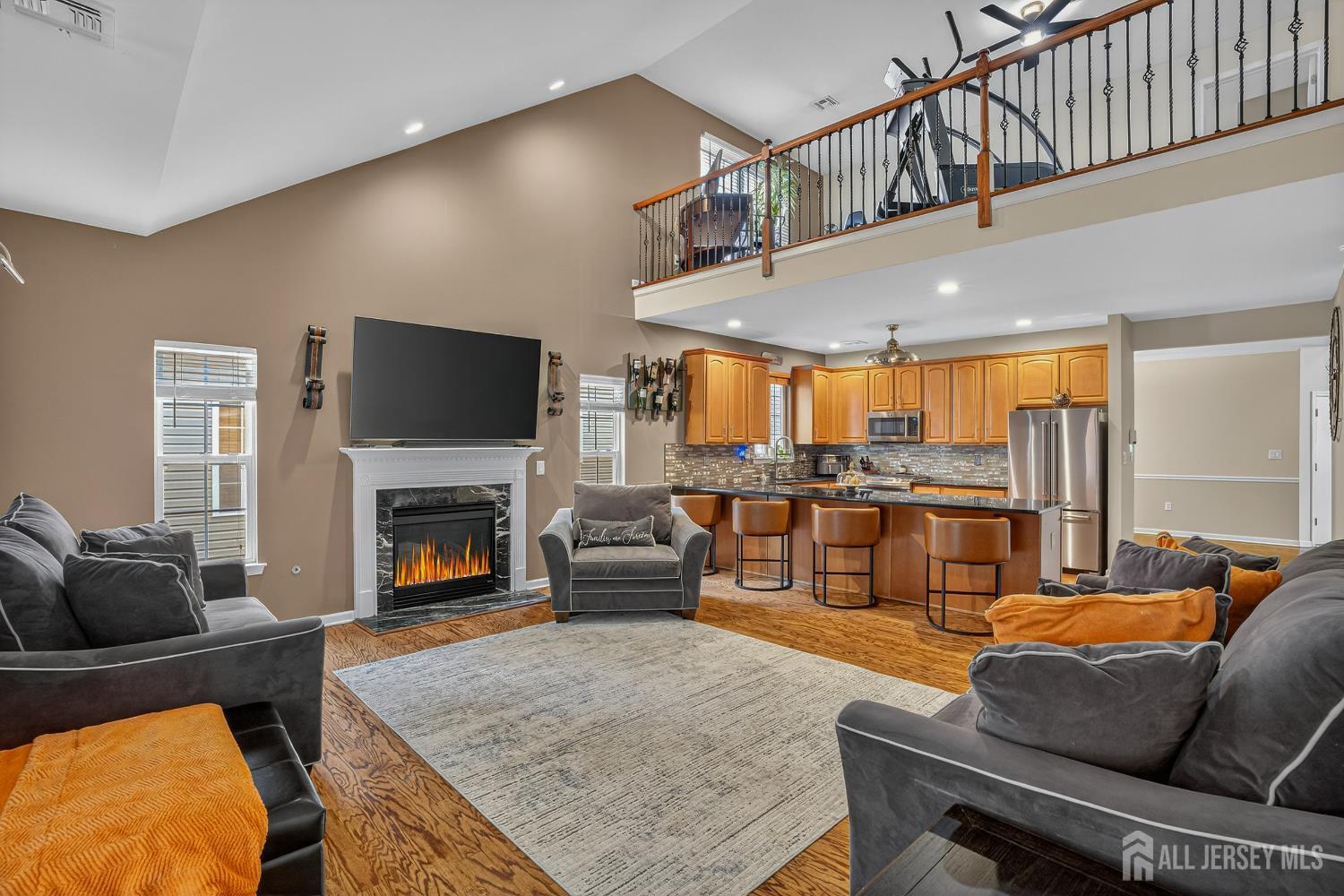 6 George Russell Way Clifton, NJ 07013 - Photo 23 of 45 a living room with furniture fireplace and flat screen tv